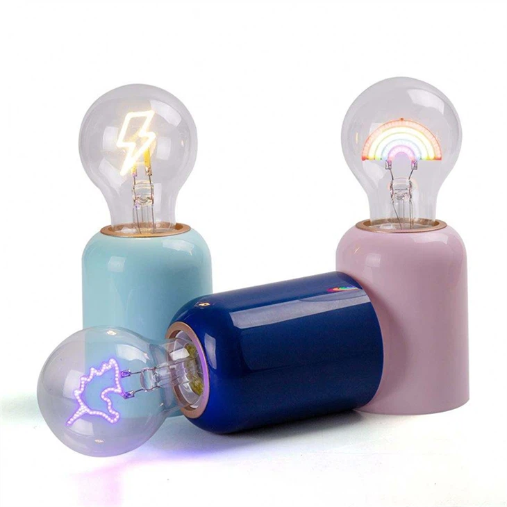 Whimsical Decorative LED Bulbs - Transparent Glass & Colorful Filament Design